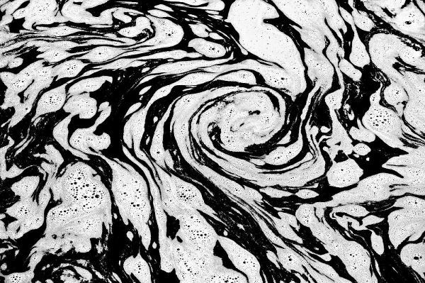 Canada, Manitoba Foam patterns in water